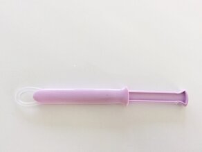 Vaginal ring in applicator